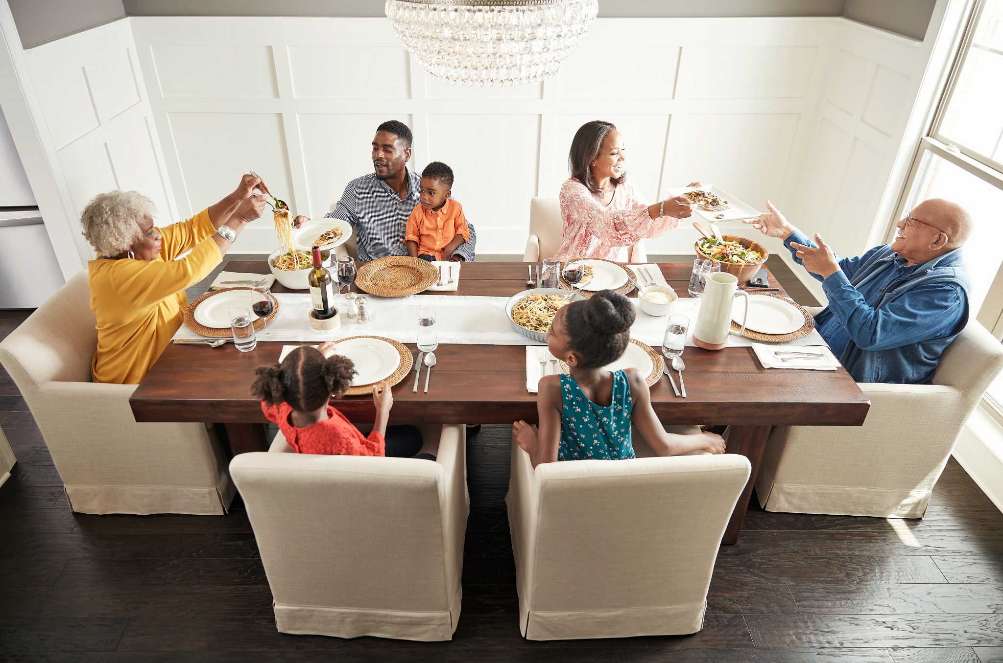 Family having breakfast at the dining table | Staff Carpet