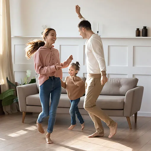 Happy family dancing on floor | Staff Carpet